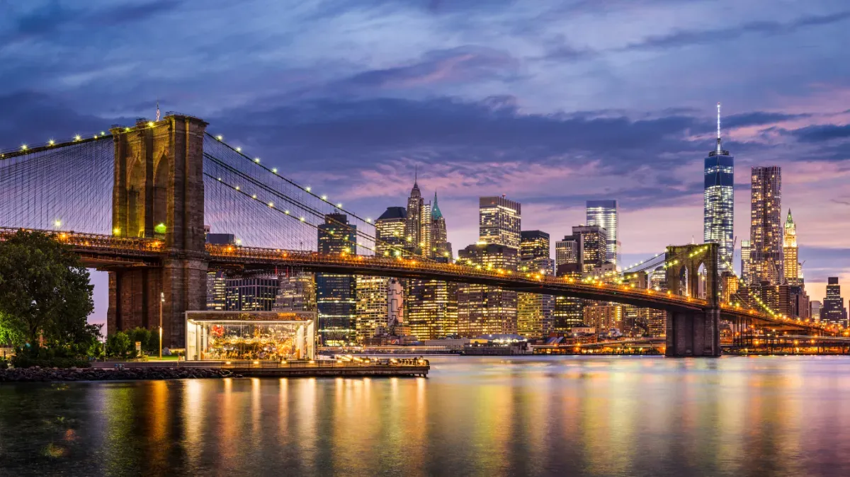 Brooklyn Bridge and Lower Manhattan skyline at dusk