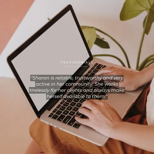 Hands working with a laptop at a desk